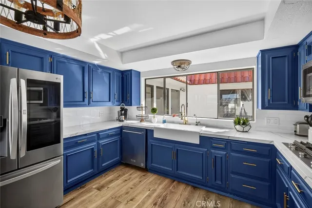 a spacious bedroom with two beds and a lamp with window