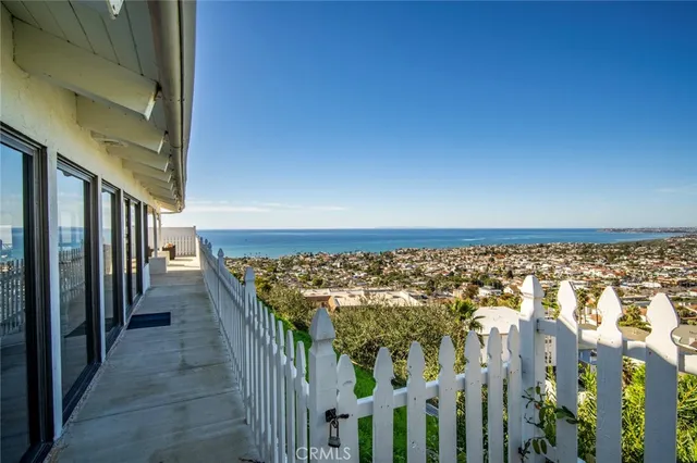 an aerial view of residential building and ocean