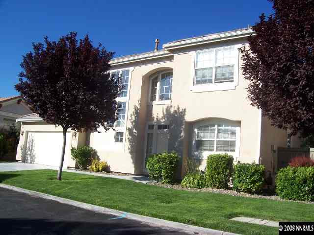 9679 Truckee Meadows Place Reno, NV 89521 - Photo 1 of 9 a front view of a house with a yard
