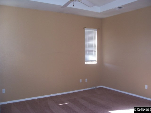 9679 Truckee Meadows Place Reno, NV 89521 - Photo 4 of 9 an empty room with a window