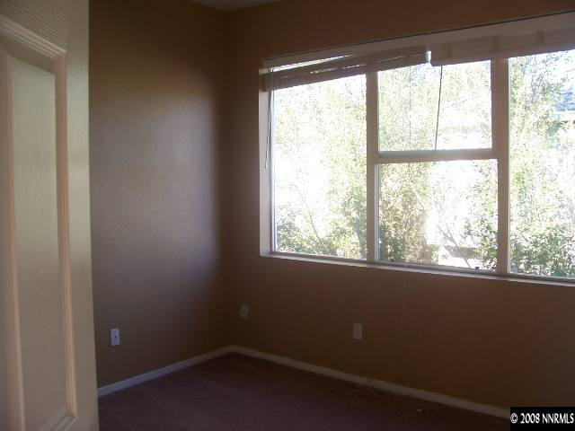 9679 Truckee Meadows Place Reno, NV 89521 - Photo 8 of 9 a view of an empty room with a window