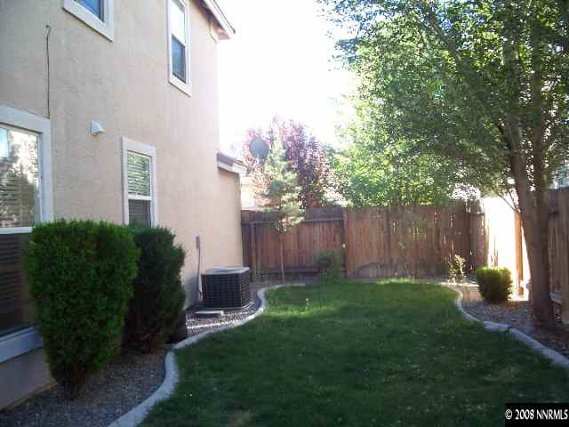 9679 Truckee Meadows Place Reno, NV 89521 - Photo 9 of 9 a backyard of a house with lots of green space