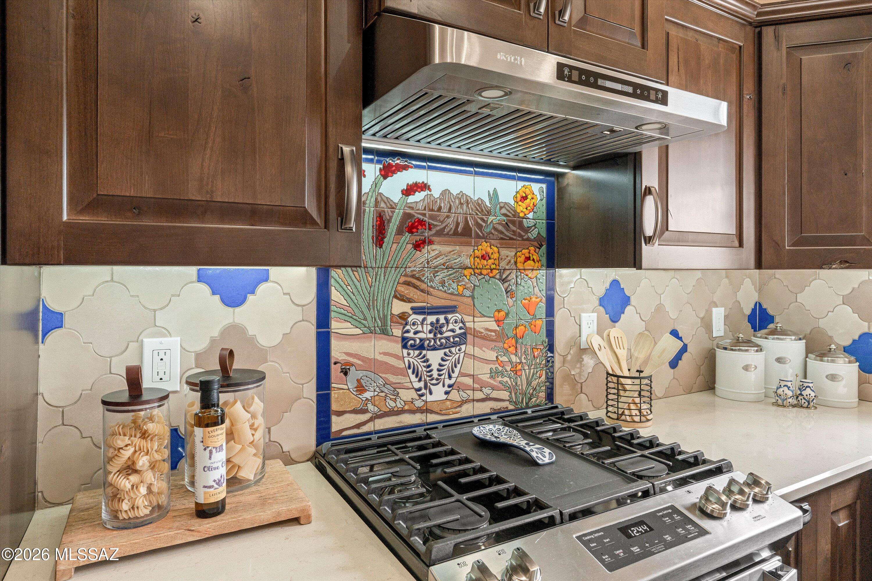 4760 East Wagon Train Road Tucson, AZ 85739 - Photo 4 of 38 a stove top oven sitting inside of a kitchen