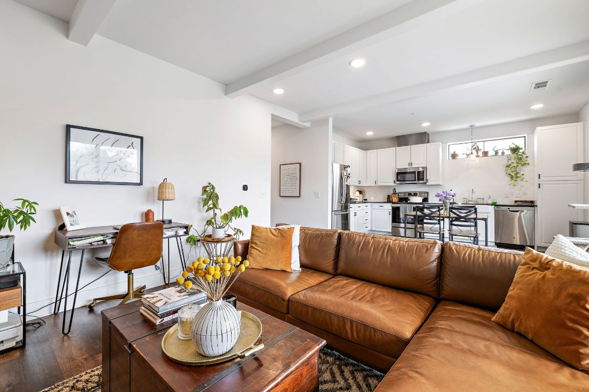 4704 Sunset Trail, Unit 1101 Austin, TX 78745 - Photo 1 of 23 Living room featuring beamed ceiling, dark wood-style flooring, and recessed lighting