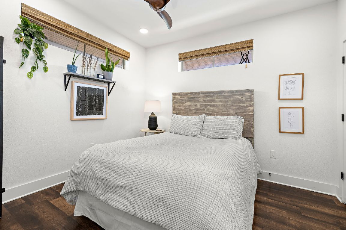 4704 Sunset Trail, Unit 1101 Austin, TX 78745 - Photo 16 of 23 Bedroom with dark wood-style floors, ceiling fan, and recessed lighting