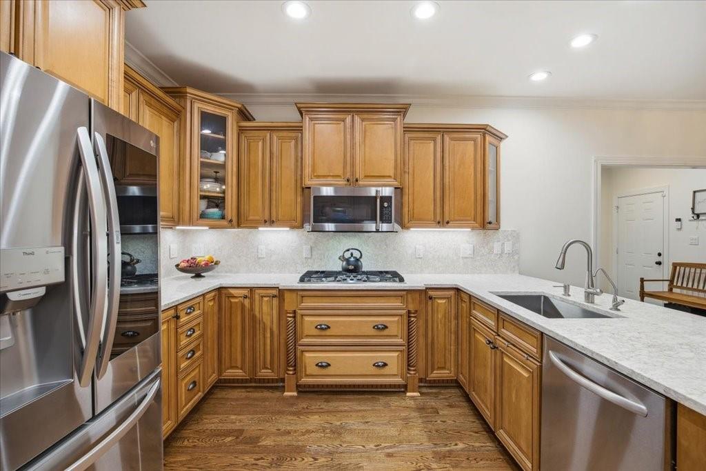 397 Thomas Road Dallas, GA 30132 - Photo 23 of 108 a kitchen with stainless steel appliances granite countertop a sink stove and refrigerator
