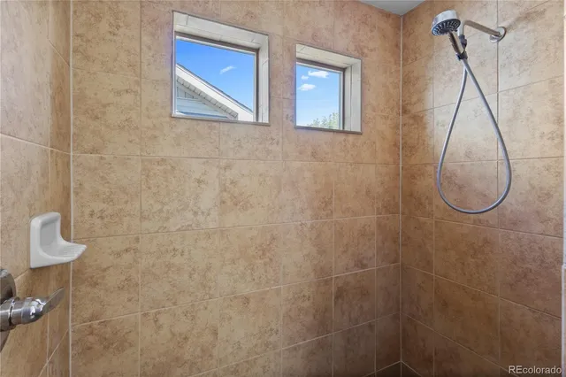 a bathroom with a sink double vanity and a shower