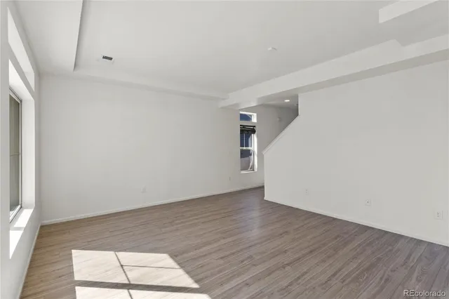 a view of livingroom with hardwood floor and workspace