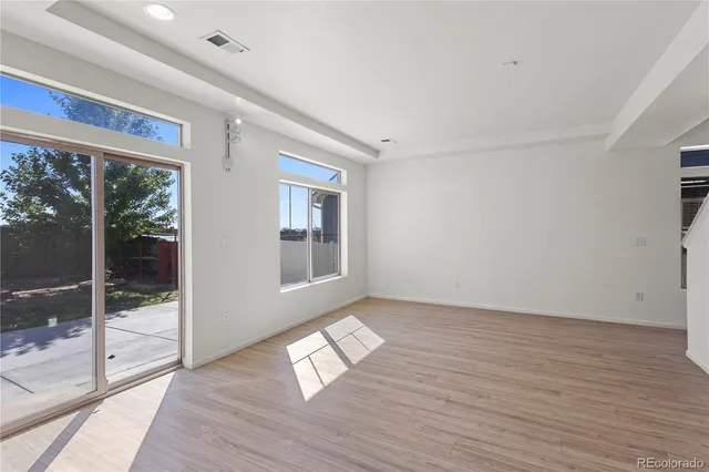 a kitchen with kitchen island granite countertop stainless steel appliances cabinets a sink and a counter top space