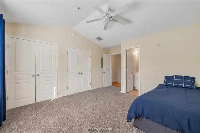 a furnished livingroom with a ceiling fan