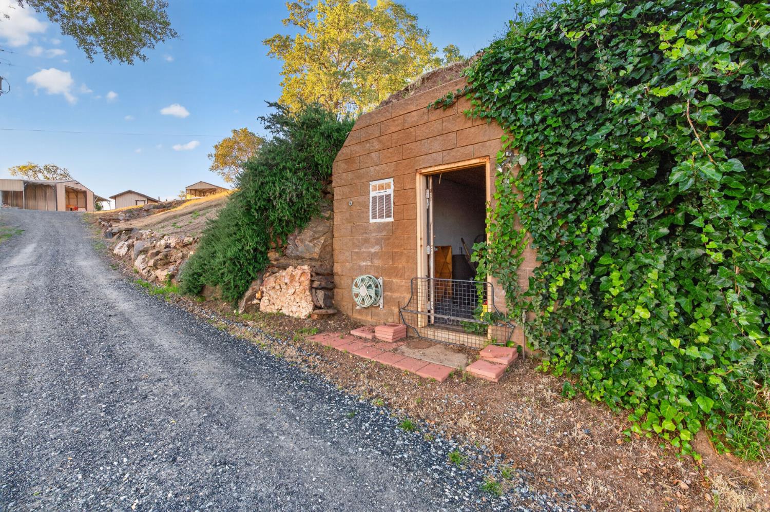 7570 Airola Road Vallecito, CA 95251 - Photo 70 of 90 a view of a house with a yard and floor to ceiling window