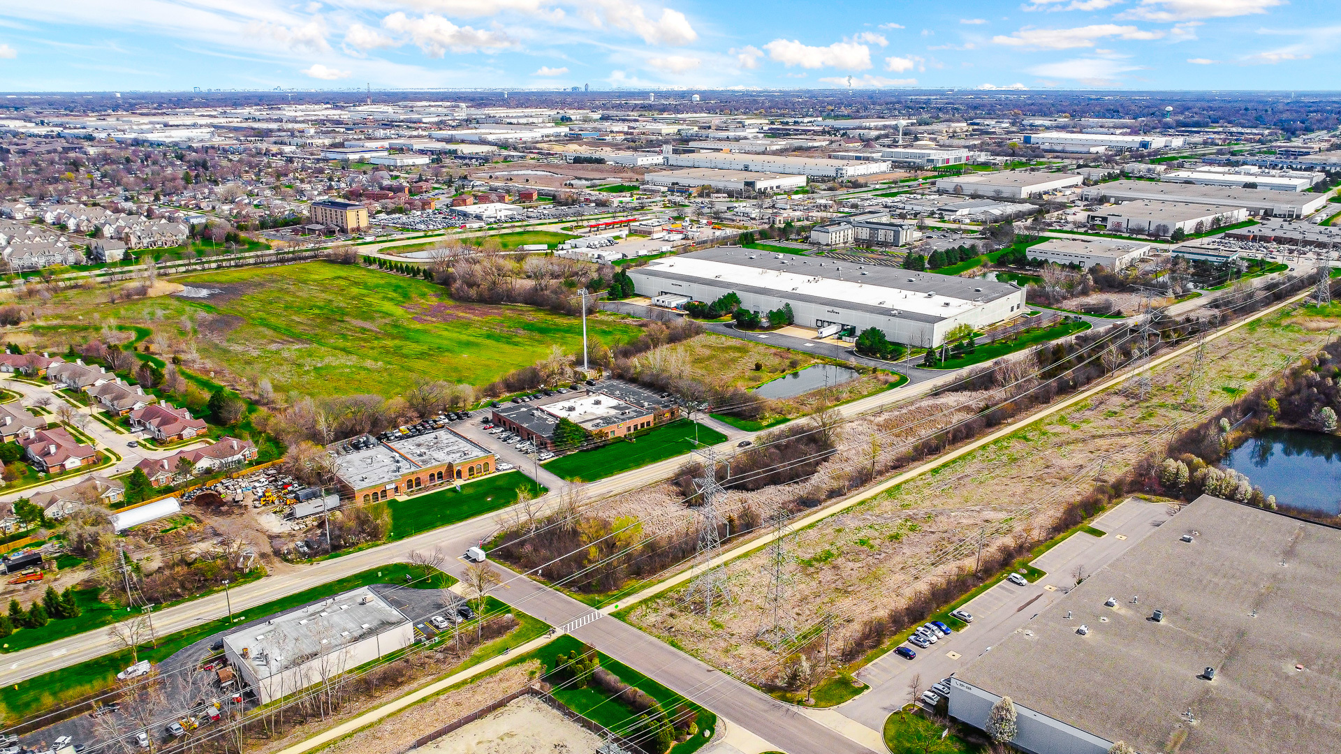an aerial view of residential houses with outdoor space