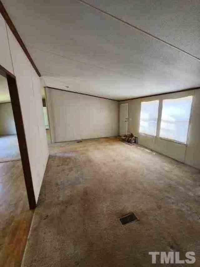 165 Bella Russell Road Manson, NC 27553 - Photo 2 of 7 a view of an empty room with a window
