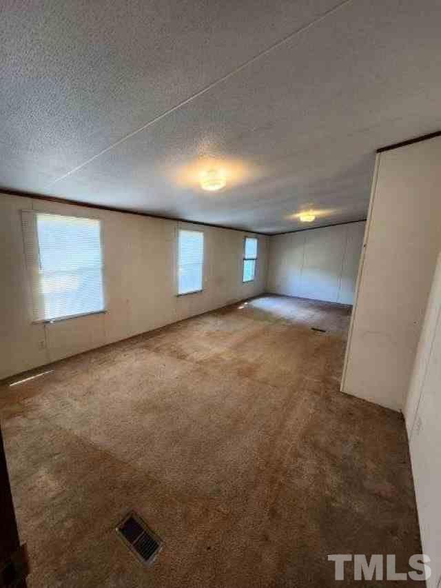 165 Bella Russell Road Manson, NC 27553 - Photo 4 of 7 a view of an empty room with a window