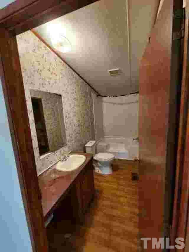 165 Bella Russell Road Manson, NC 27553 - Photo 5 of 7 a bathroom with a sink a toilet and shower