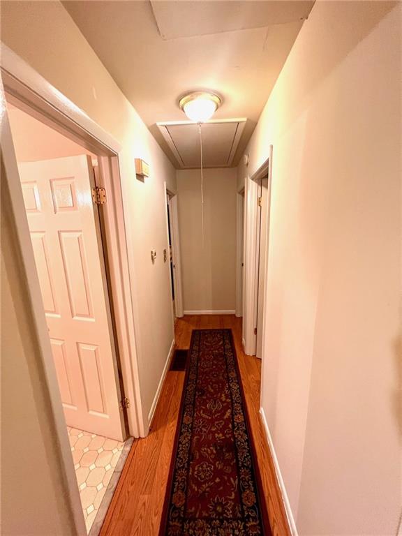 281 Springdale Drive Winder, GA 30680 - Photo 7 of 12 a view of a hallway with wooden floor and staircase