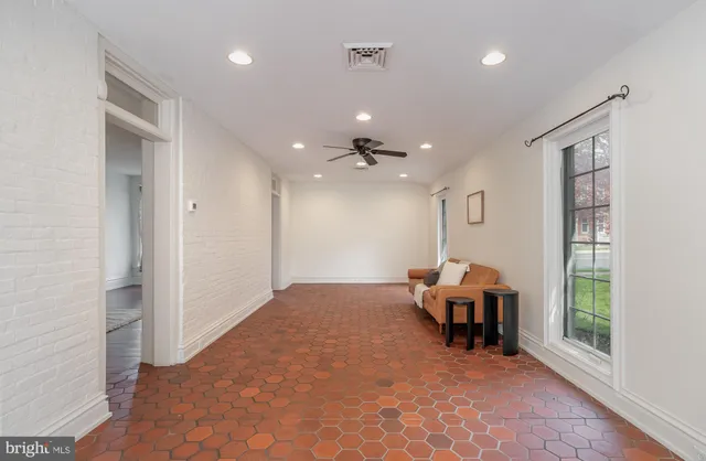 a view of a livingroom with furniture and windows