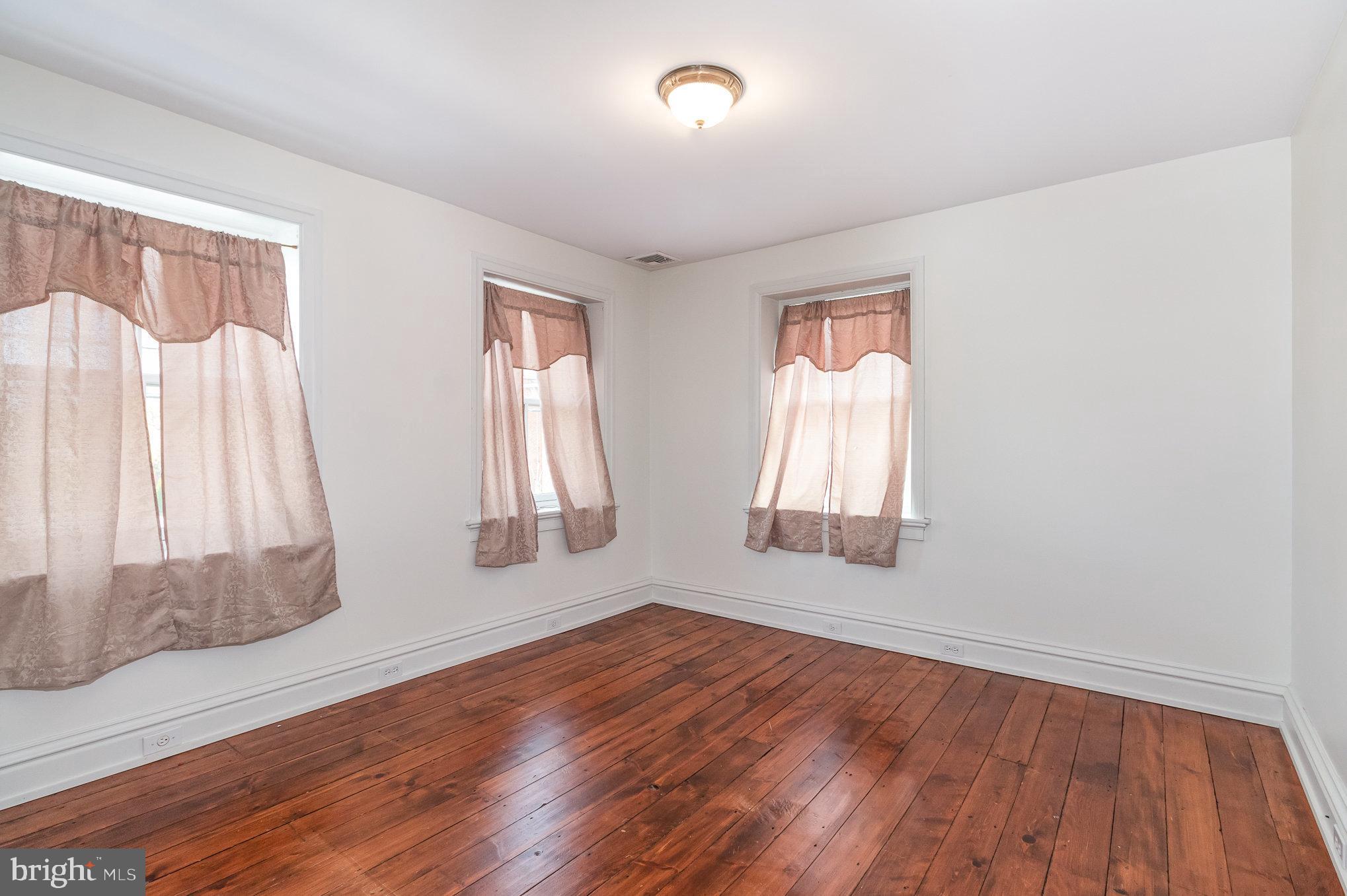 308 East Derry Road Hershey, PA 17033 - Photo 25 of 48 an empty room with wooden floor and windows