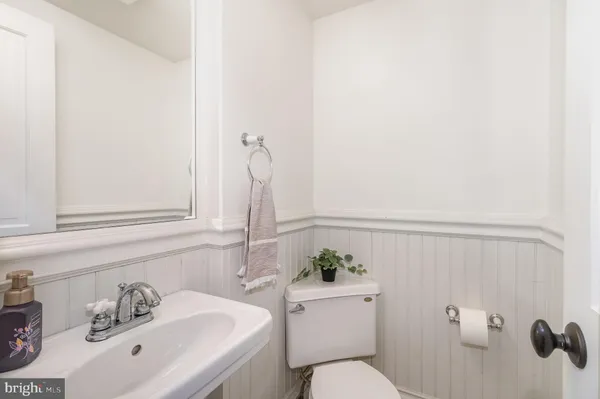 a bathroom with a sink and toilet