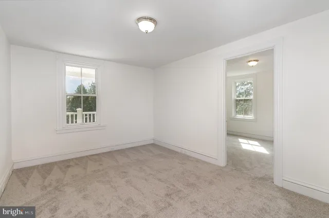 an empty room with windows