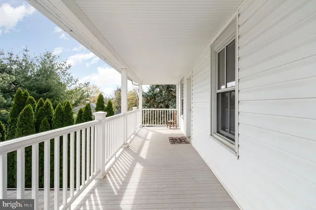 a view of a balcony with wooden floor