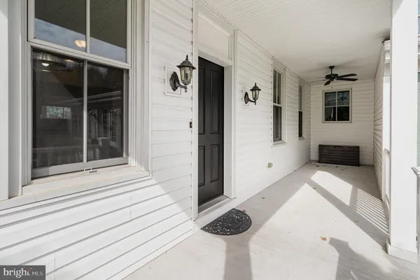 a view of bathroom with tub and shower
