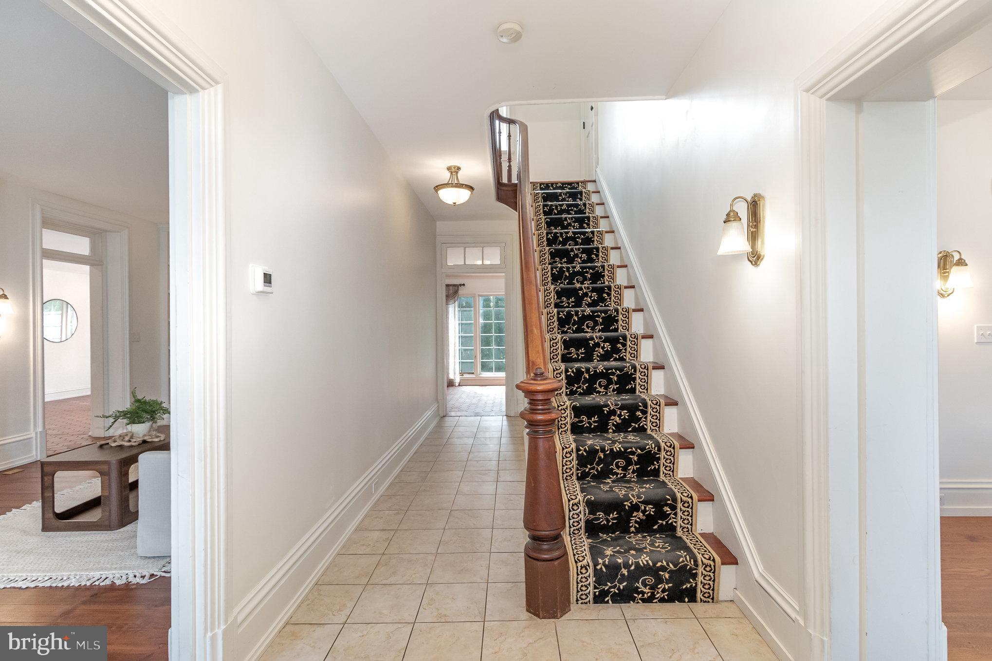 308 East Derry Road Hershey, PA 17033 - Photo 9 of 48 a view of hallway with stairs and living room