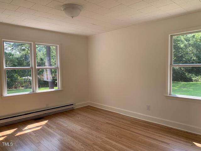 1003 Summerville Mamers Road Lillington, NC 27546 - Photo 21 of 44 an empty room with wooden floor and windows