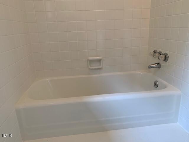 1003 Summerville Mamers Road Lillington, NC 27546 - Photo 23 of 44 a bathroom with a bathtub