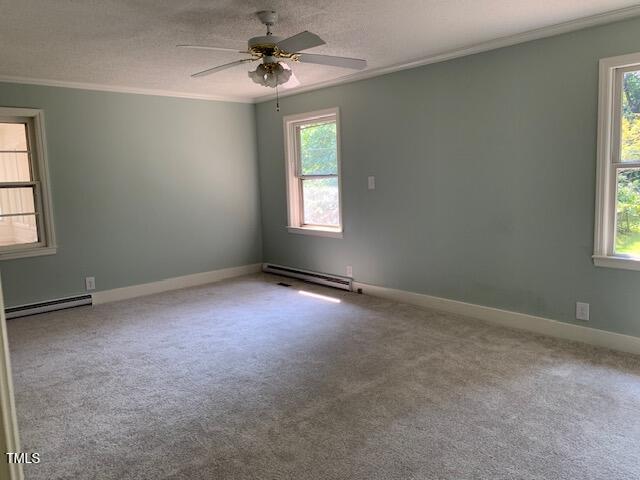 1003 Summerville Mamers Road Lillington, NC 27546 - Photo 26 of 44 an empty room with windows and chandelier fan