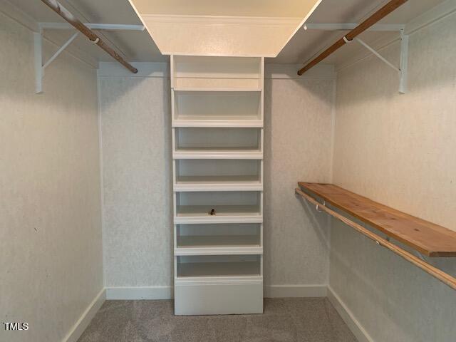 1003 Summerville Mamers Road Lillington, NC 27546 - Photo 28 of 44 a view of walk in closet with empty racks