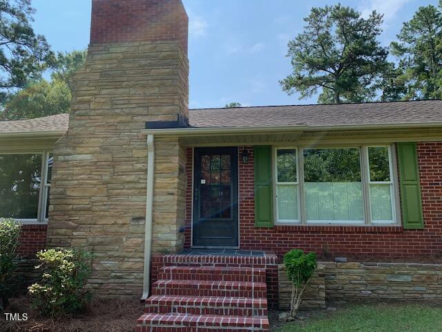 1003 Summerville Mamers Road Lillington, NC 27546 - Photo 34 of 44 a view of a brick house with a large window