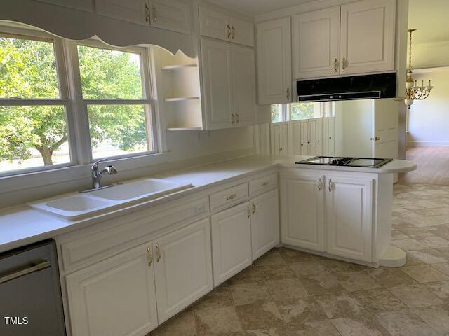 1003 Summerville Mamers Road Lillington, NC 27546 - Photo 5 of 44 a kitchen with granite countertop a sink window and cabinets