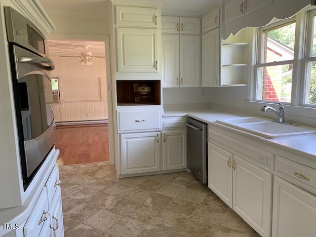 1003 Summerville Mamers Road Lillington, NC 27546 - Photo 7 of 44 a kitchen with white cabinets and a refrigerator