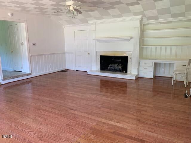 1003 Summerville Mamers Road Lillington, NC 27546 - Photo 8 of 44 an empty room with wooden floor and fireplace