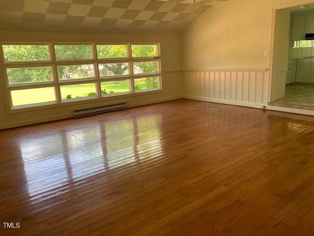 1003 Summerville Mamers Road Lillington, NC 27546 - Photo 9 of 44 a view of an empty room with wooden floor and a window