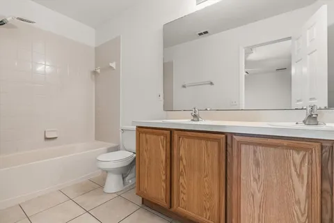 a bathroom with a sink a toilet and bathtub