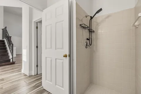 a bathroom with a glass shower door
