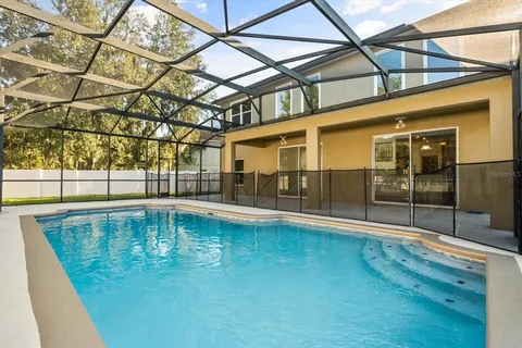 a view of a swimming pool with a patio