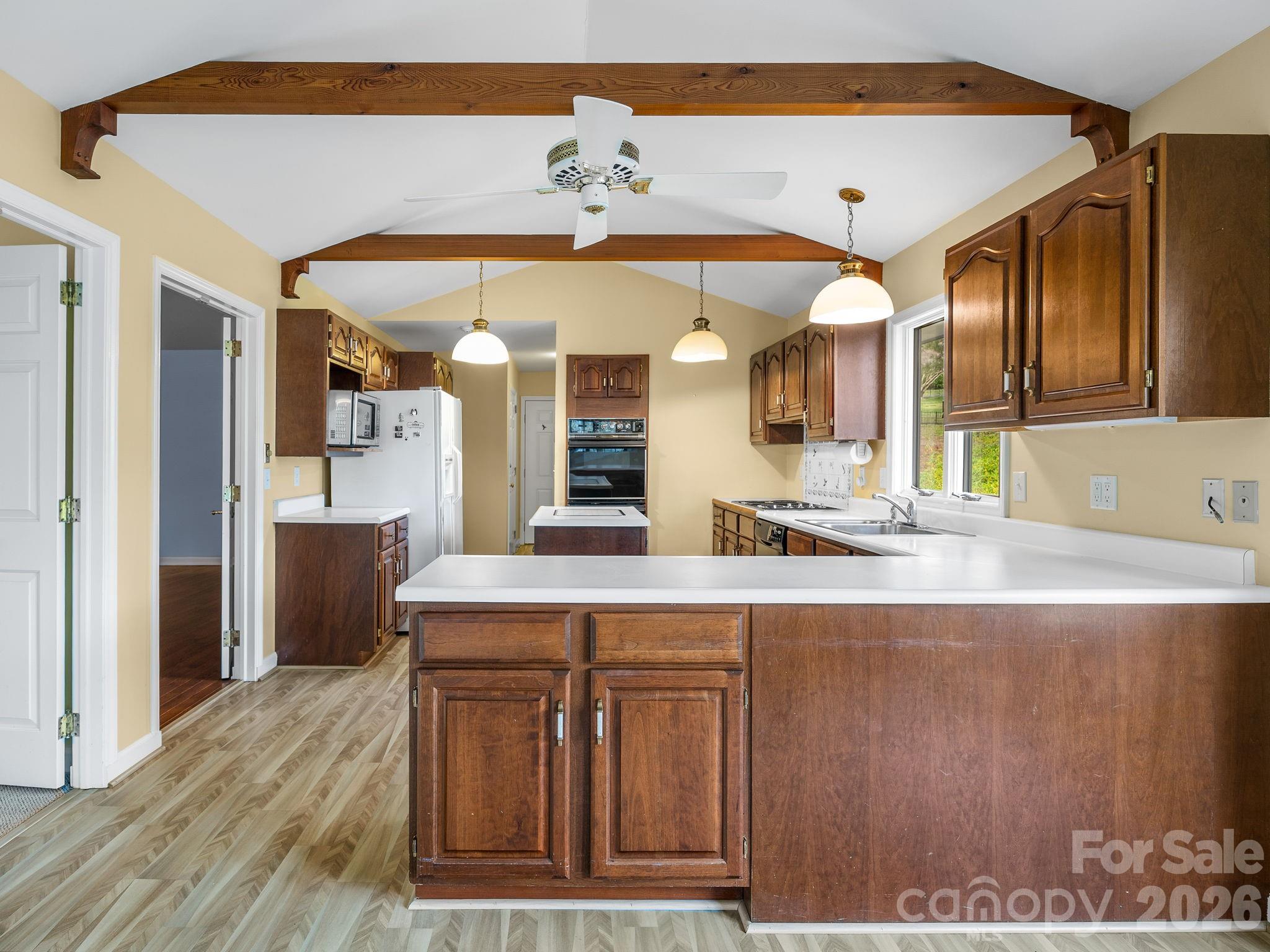 140 Meadowlark Drive Tryon, NC 28782 - Photo 12 of 45 a view of a kitchen from the hallway