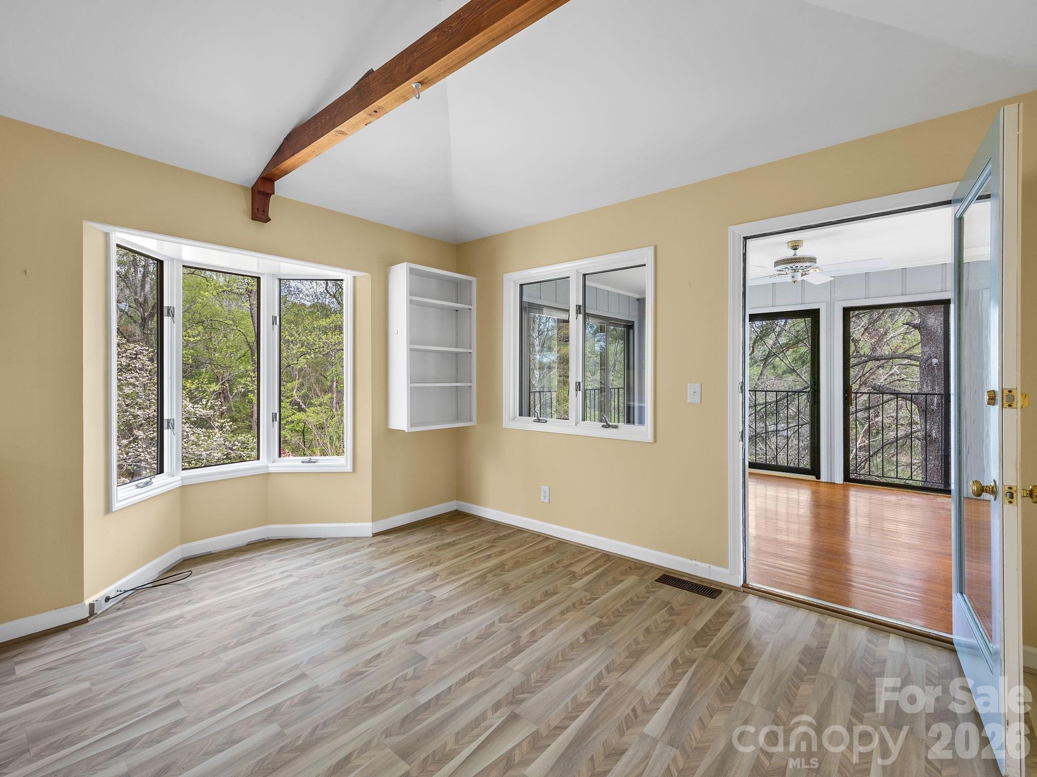 140 Meadowlark Drive Tryon, NC 28782 - Photo 18 of 45 a view of an empty room with wooden floor and a window