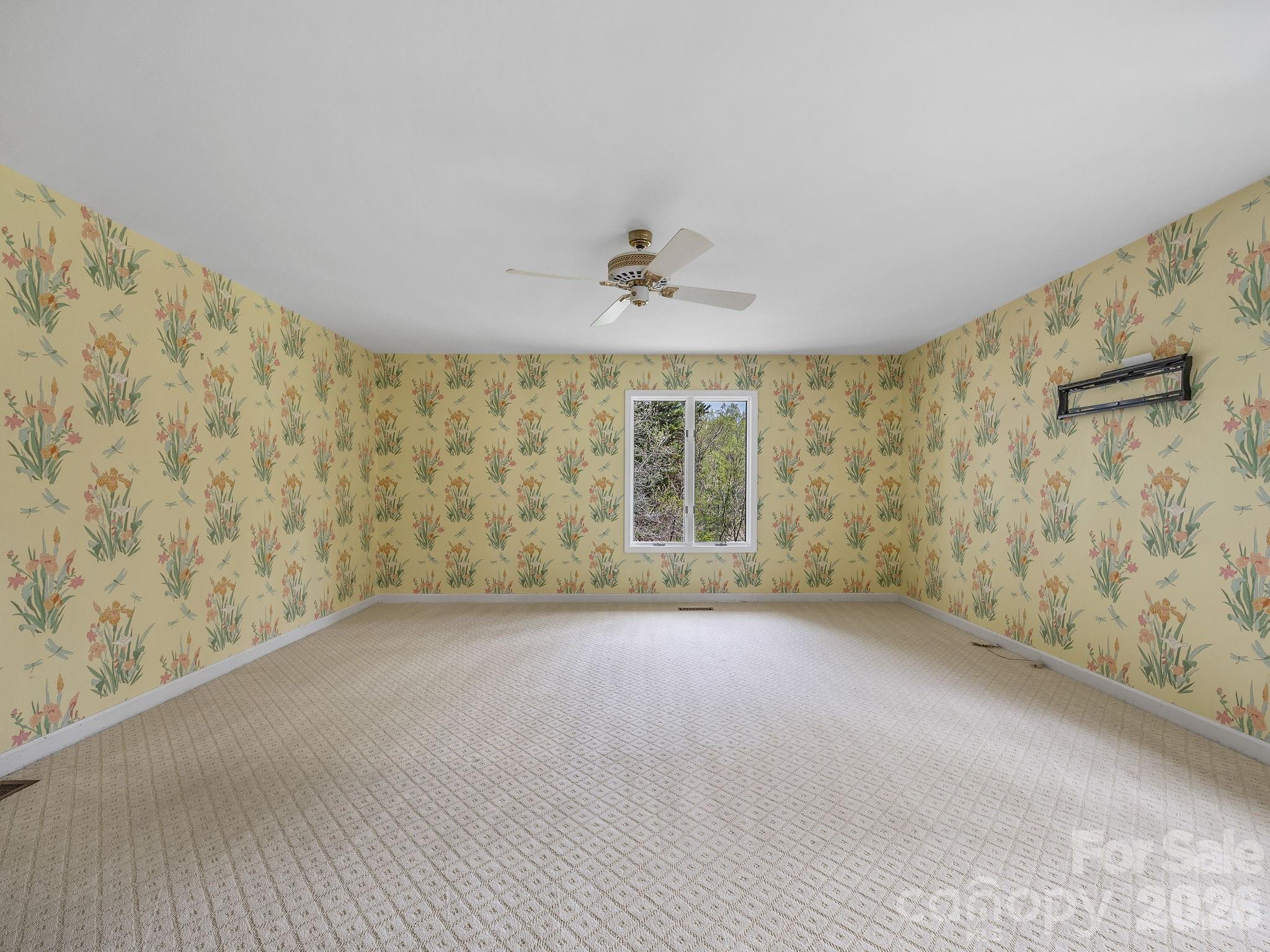 140 Meadowlark Drive Tryon, NC 28782 - Photo 20 of 45 a view of a big room with windows and chandelier fan