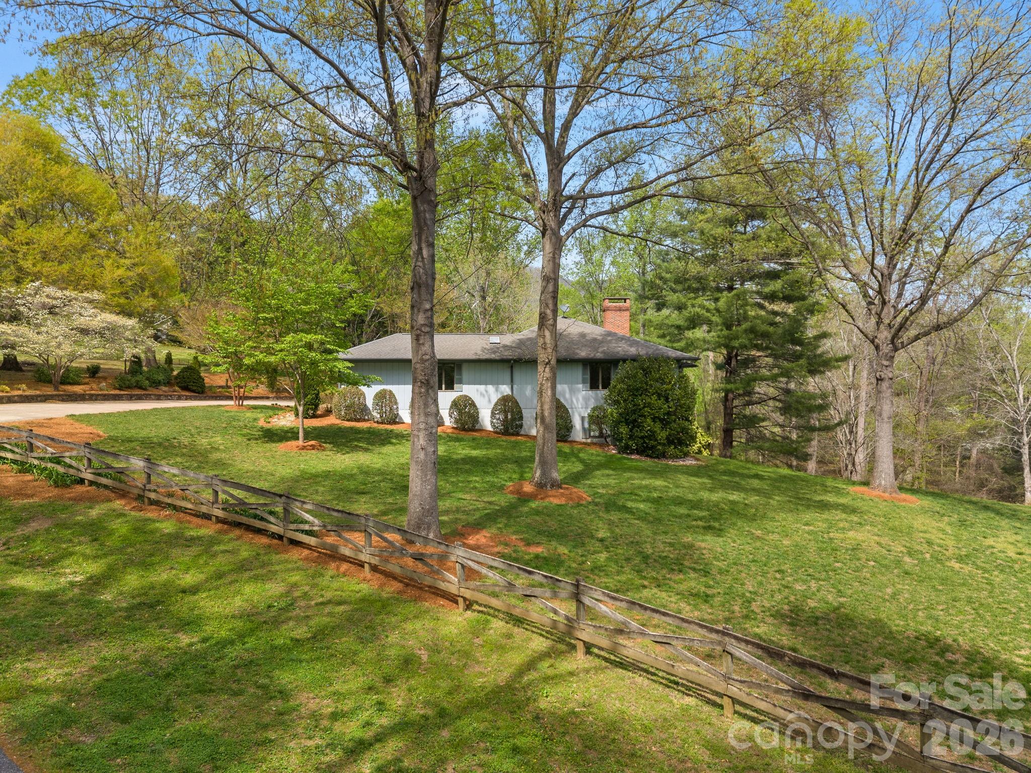 140 Meadowlark Drive Tryon, NC 28782 - Photo 2 of 45 a view of a house with a yard