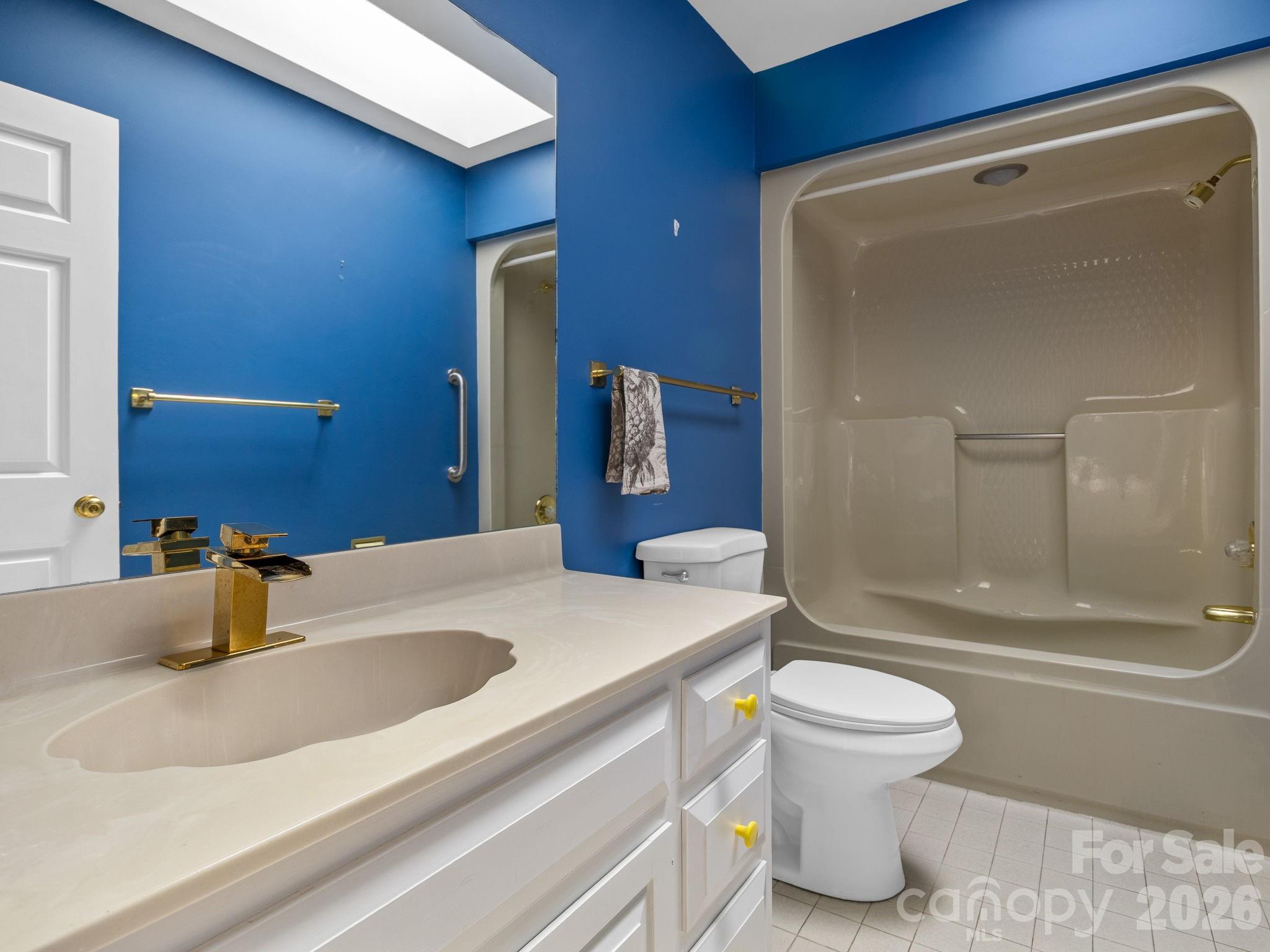 140 Meadowlark Drive Tryon, NC 28782 - Photo 25 of 45 a bathroom with a sink a toilet and shower