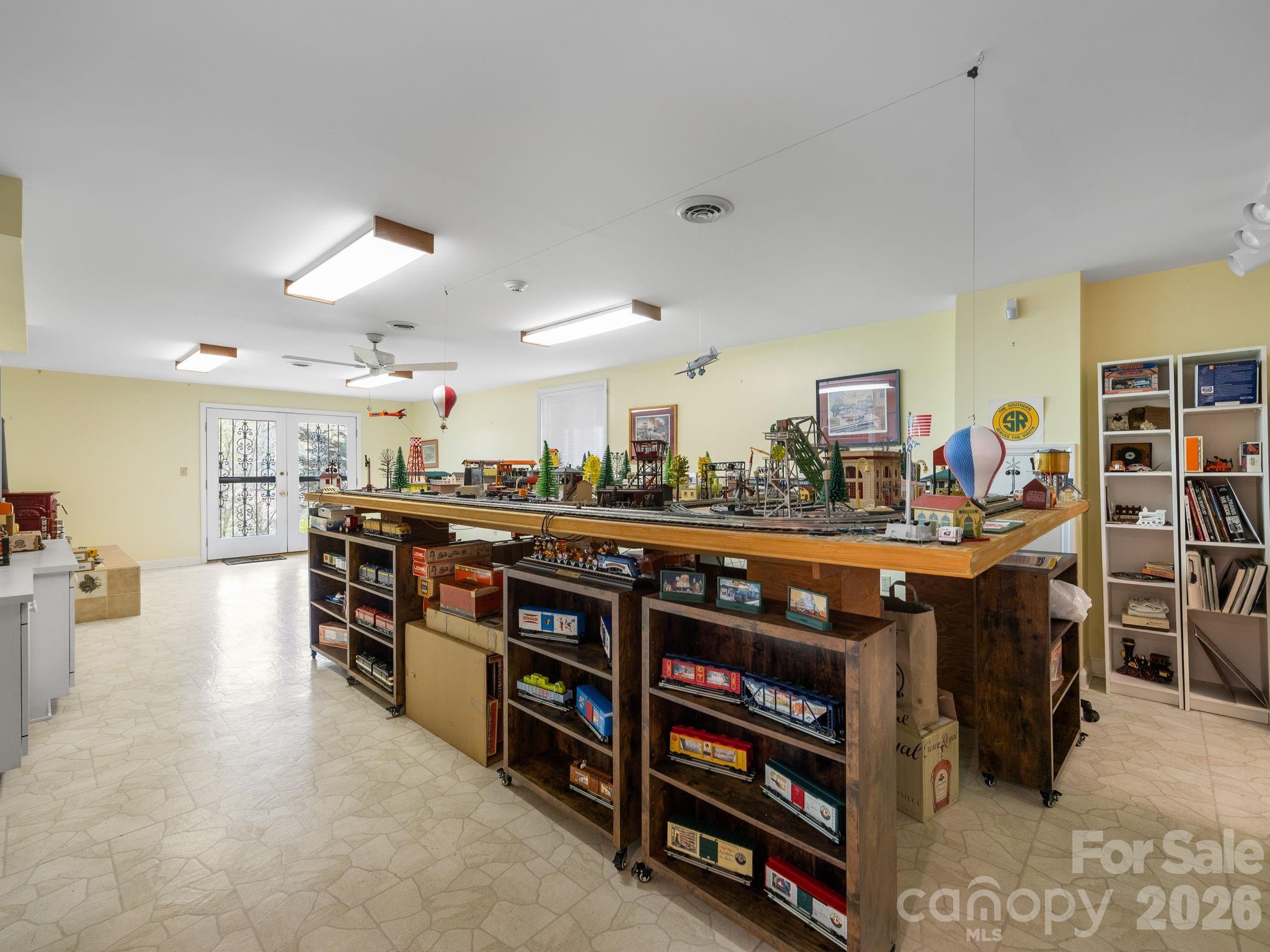 140 Meadowlark Drive Tryon, NC 28782 - Photo 29 of 45 a kitchen with stainless steel appliances kitchen island a table and chairs in it