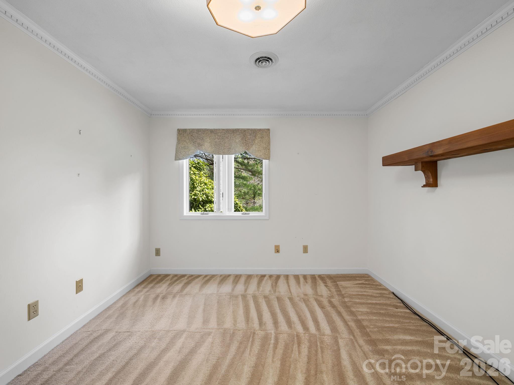 140 Meadowlark Drive Tryon, NC 28782 - Photo 35 of 45 an empty room with wooden floor and windows