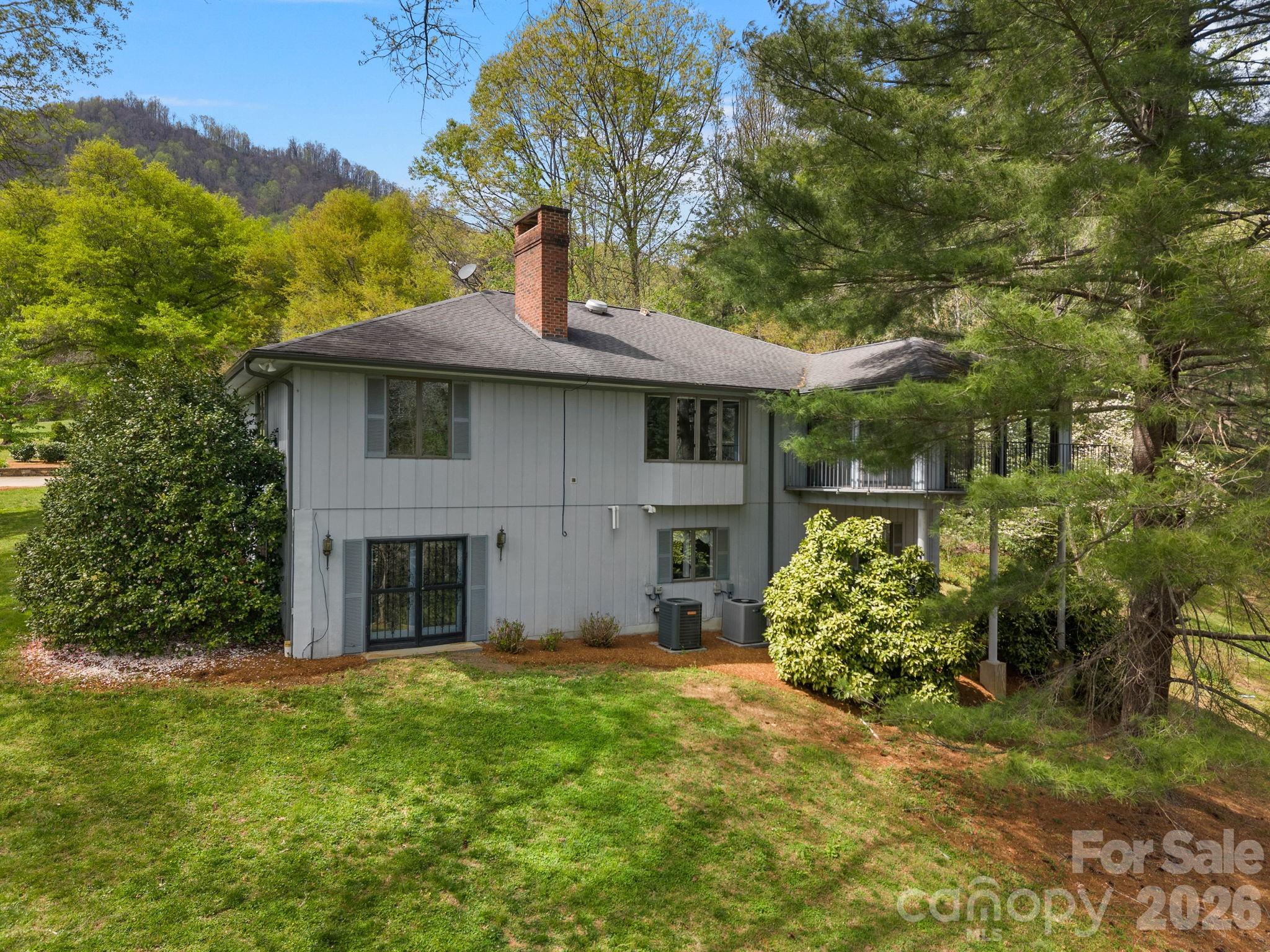 140 Meadowlark Drive Tryon, NC 28782 - Photo 41 of 45 a front view of a house with garden
