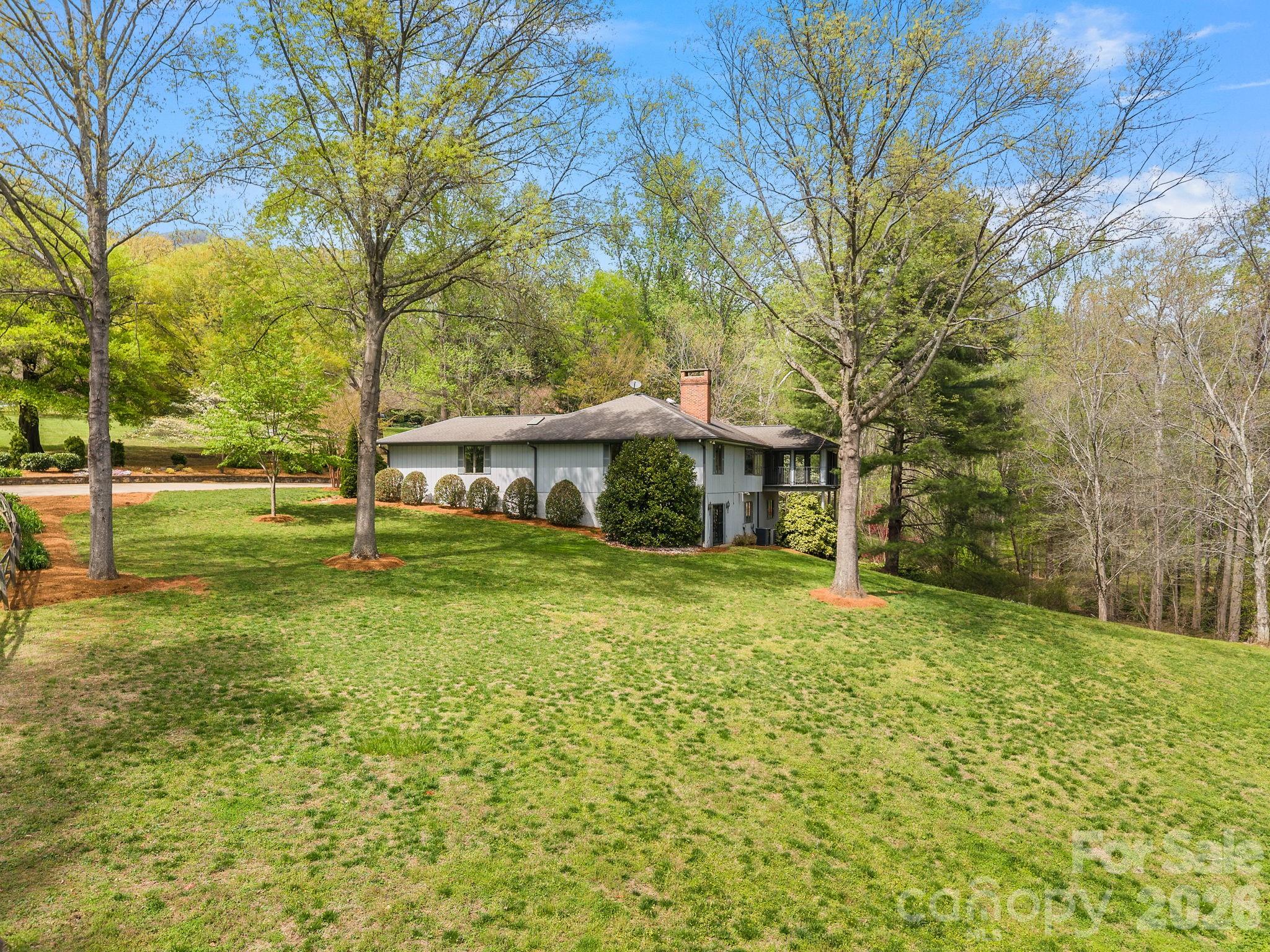 140 Meadowlark Drive Tryon, NC 28782 - Photo 44 of 45 a view of a house with a yard