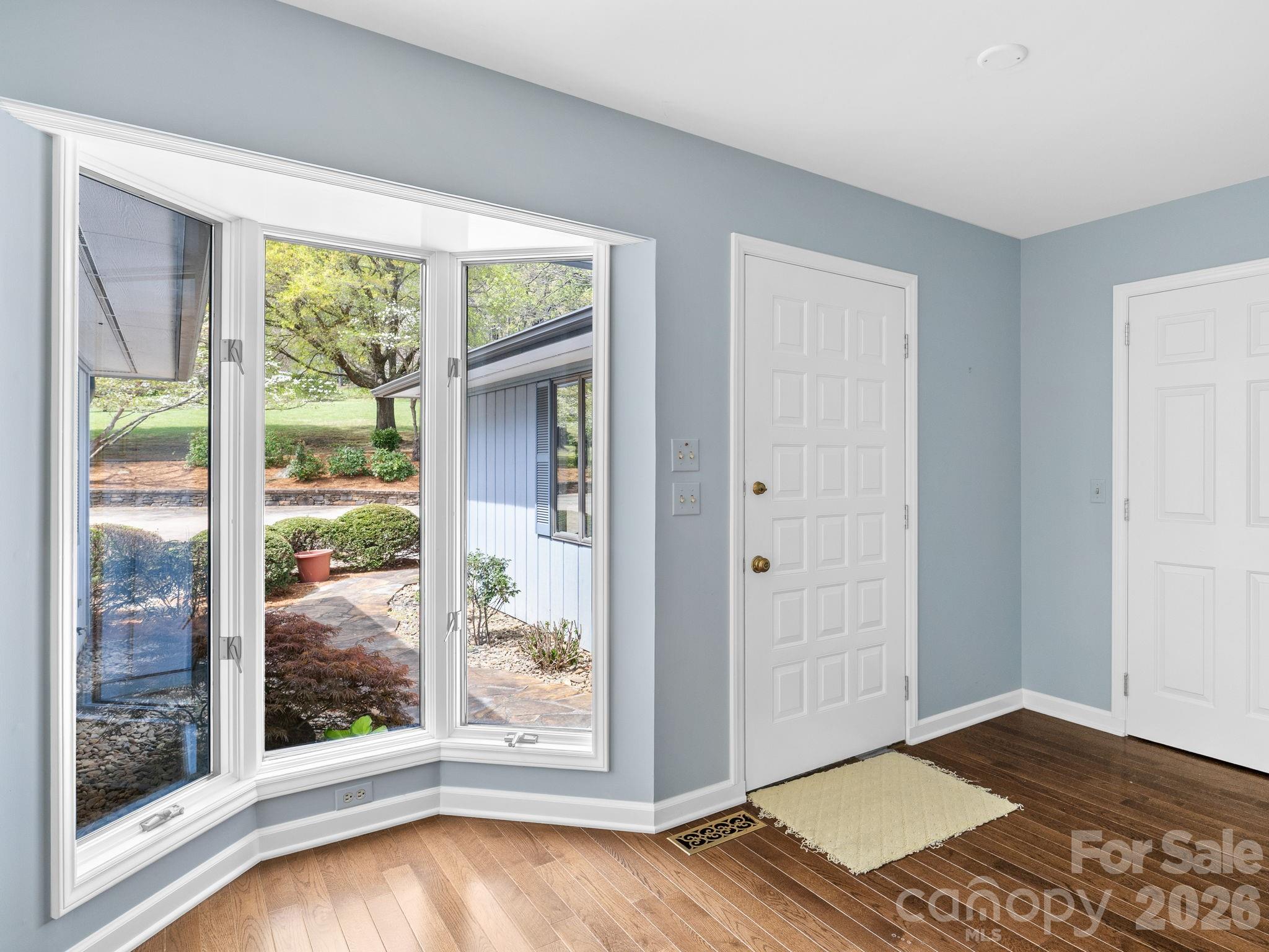 140 Meadowlark Drive Tryon, NC 28782 - Photo 6 of 45 a view of an empty room with wooden floor and a window