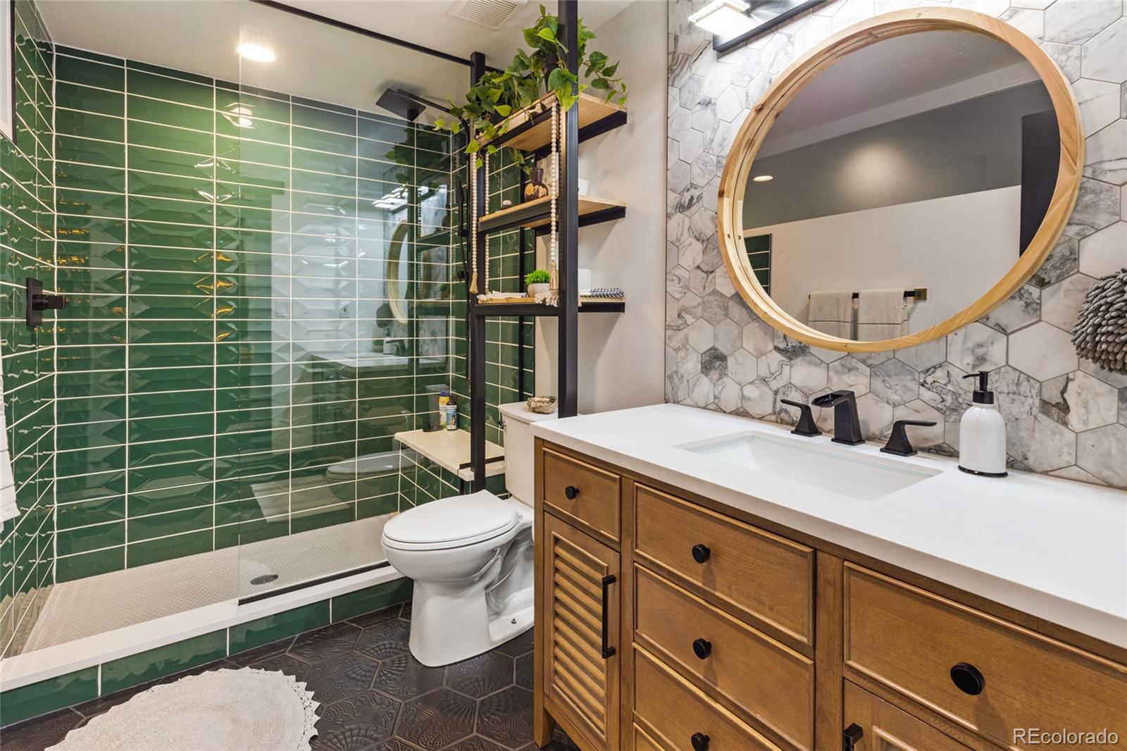 1203 24th Street Denver, CO 80205 - Photo 12 of 40 a bathroom with a sink a toilet and a mirror